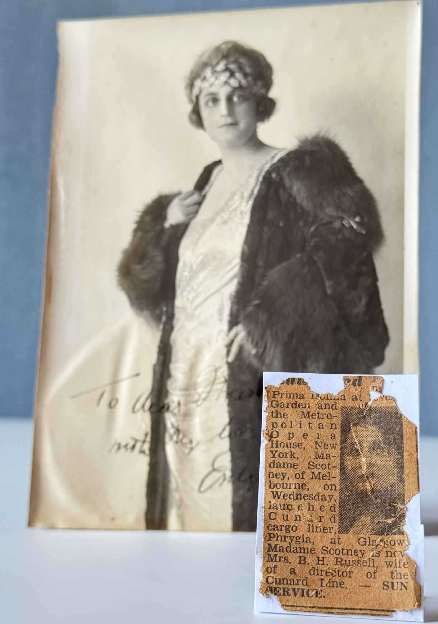 Madame Scotney with newspaper article