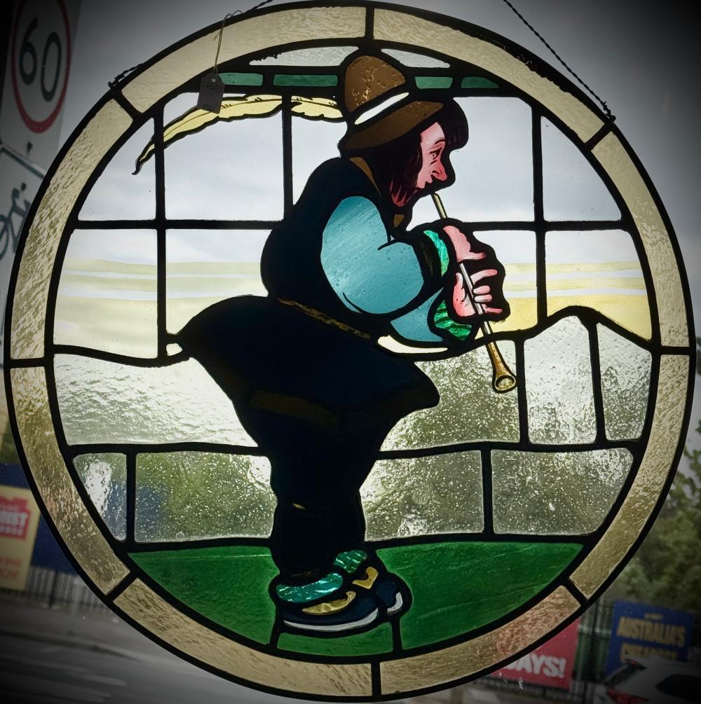 Leadlight roundel panel depicting a mediaeval musician, mid-20th century