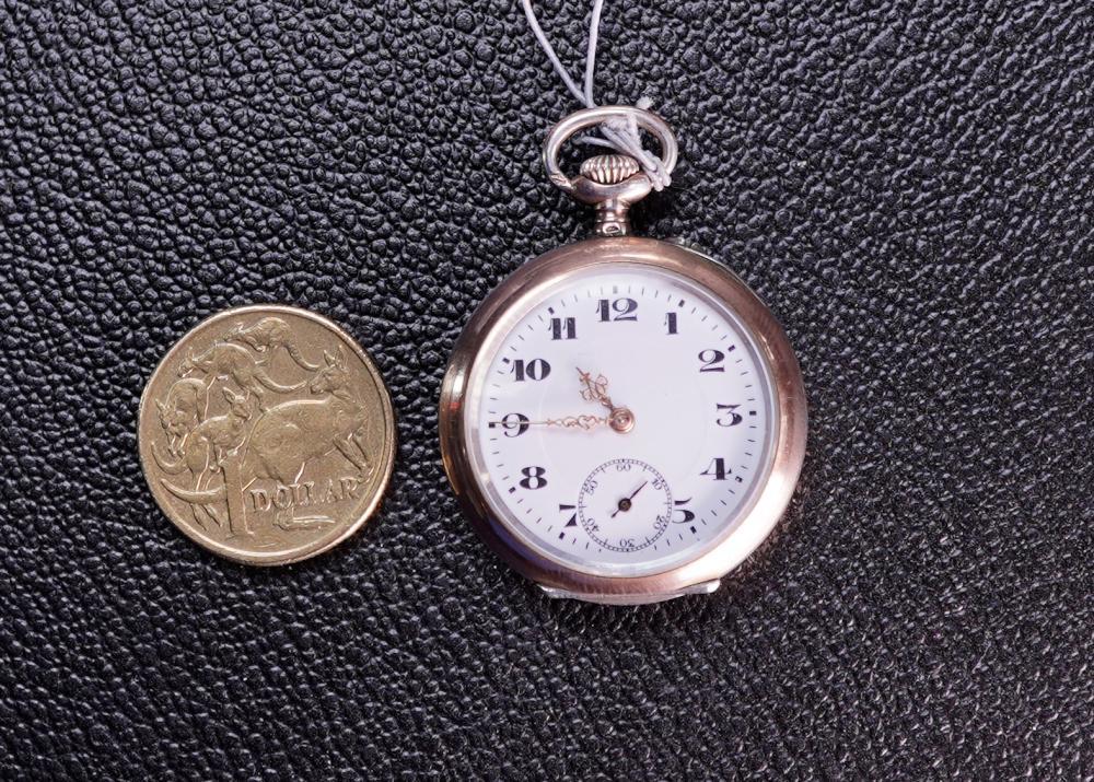Lady's silver open-face pocket watch, engine-turned case with engraved monogram, circa 1900