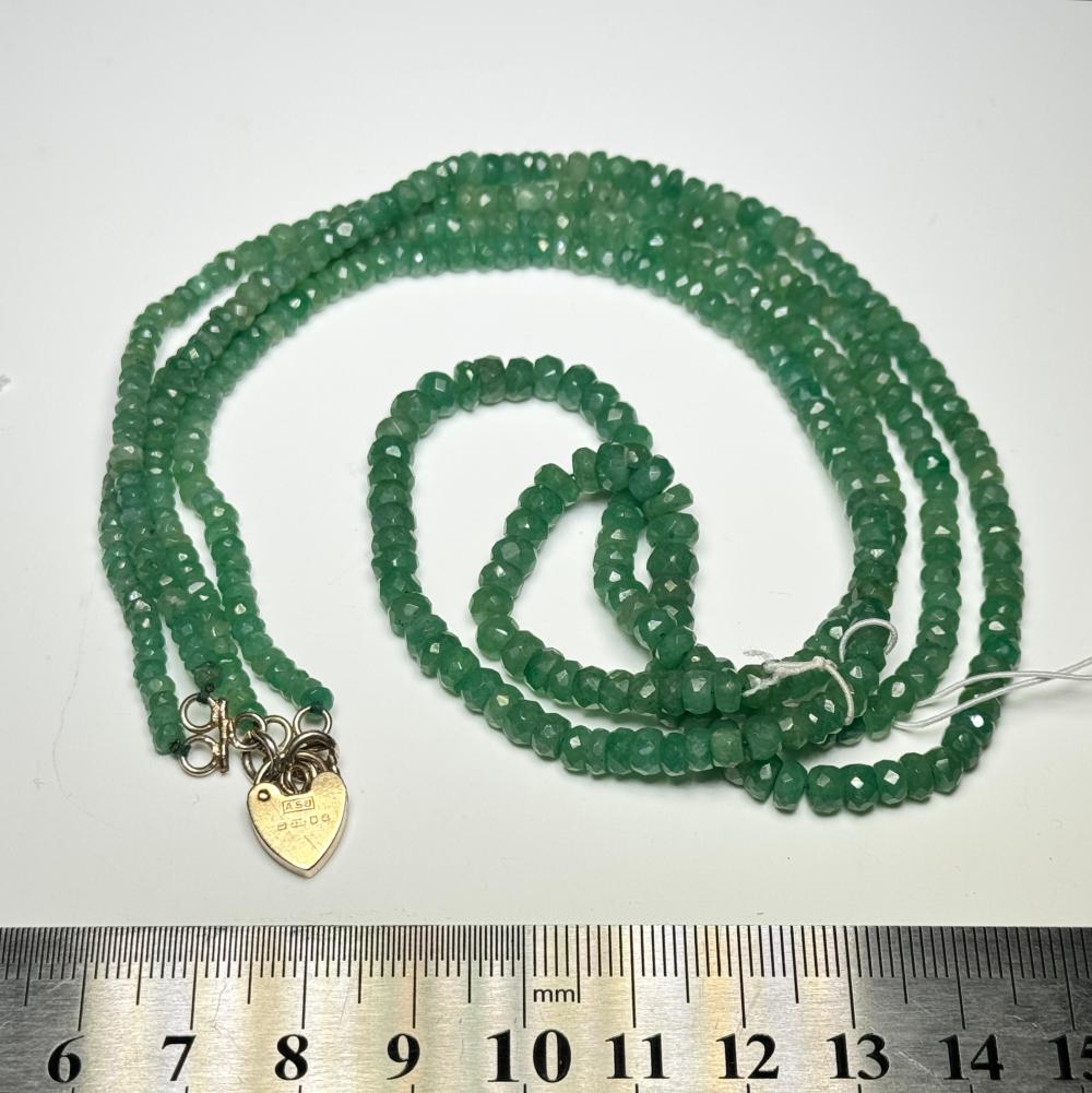 Double strand faceted green jade bead necklace with 9ct gold heart padlock clasp, 20th c.