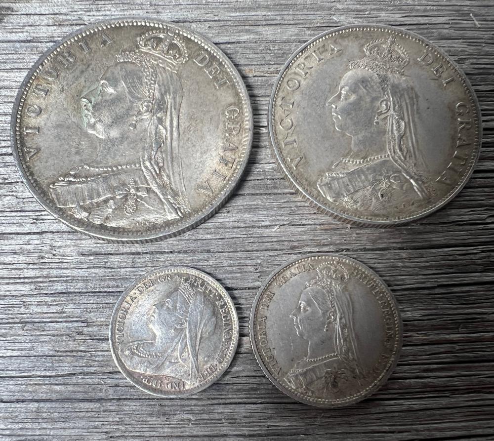Group of four Victorian silver coins, 1887-1897