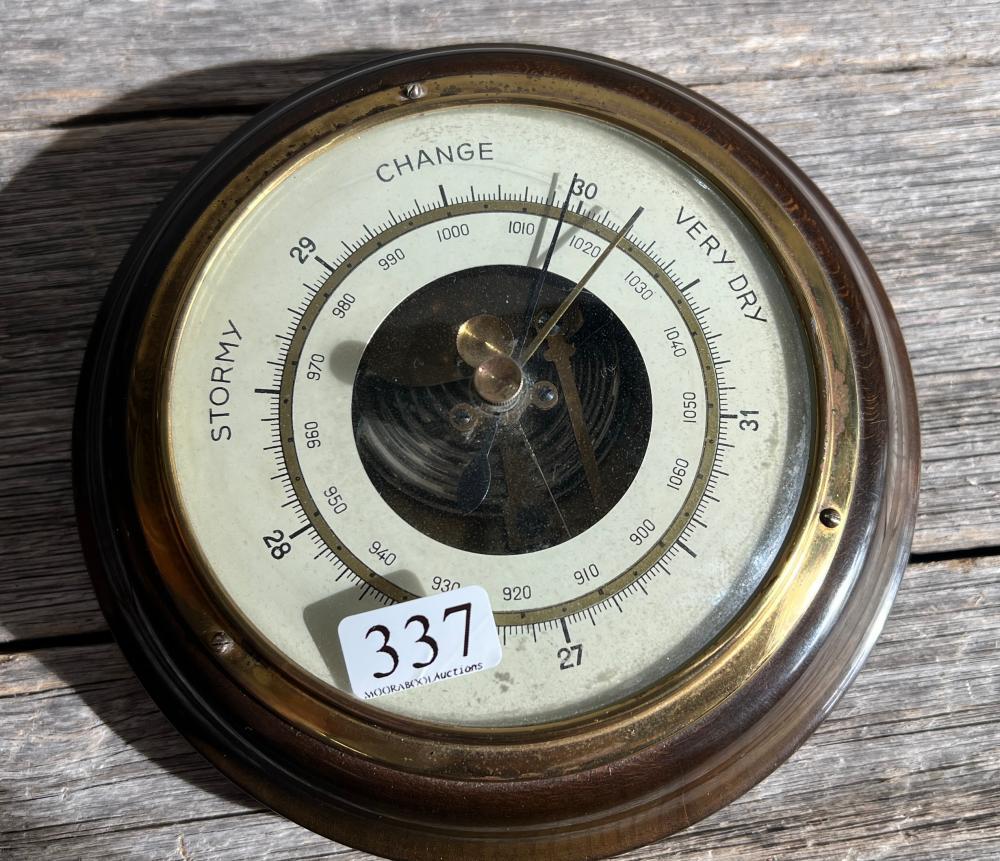 English circular brass aneroid barometer, twin-needle, on turned walnut backing board, c. 1900–1930