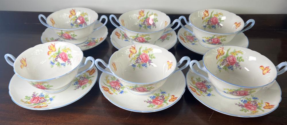 Set of six Shelley bone china two-handled cream soup cups and saucers, polychrome floral bouquet pattern with pale blue line borders, circa 1930–1940