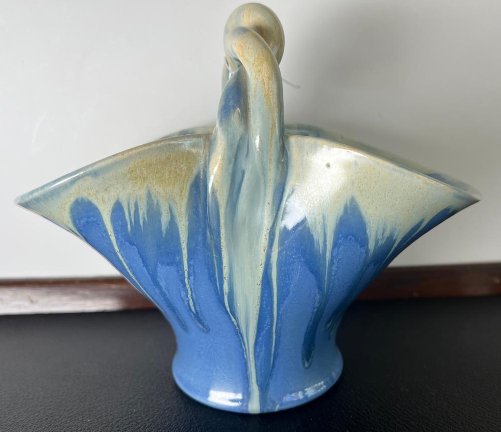 Remued Australian pottery basket vase, fan form with twisted overhead handle, periwinkle blue and cream drip glaze, circa 1930s–1940s