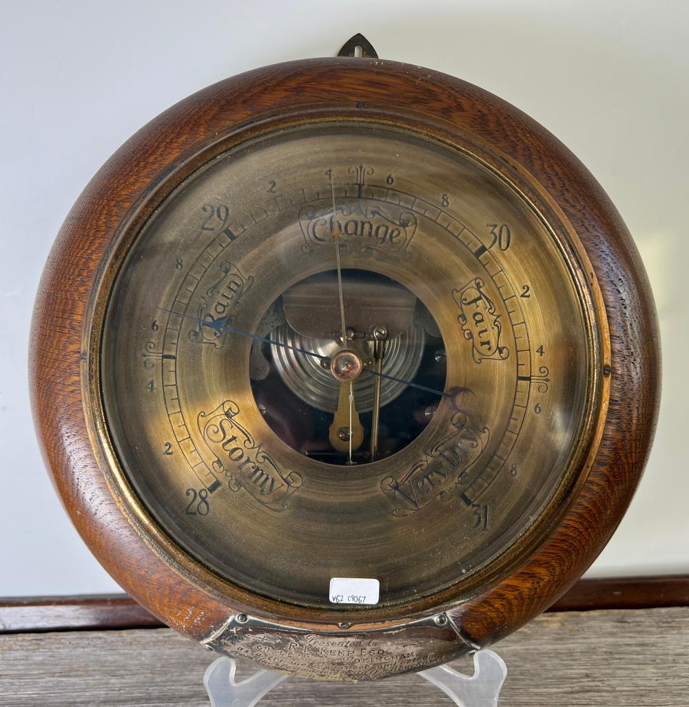 English oak aneroid wall barometer with silver-plated presentation plaque, 1927
