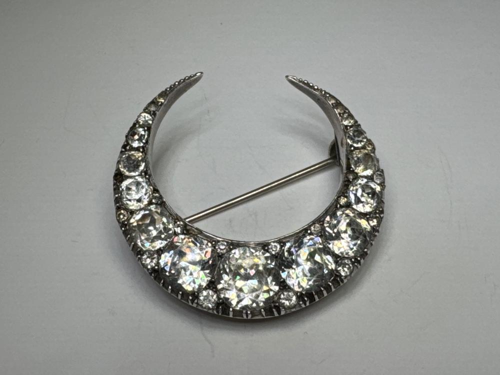 Large crescent brooch, silver mount set with paste stones, circa 1910