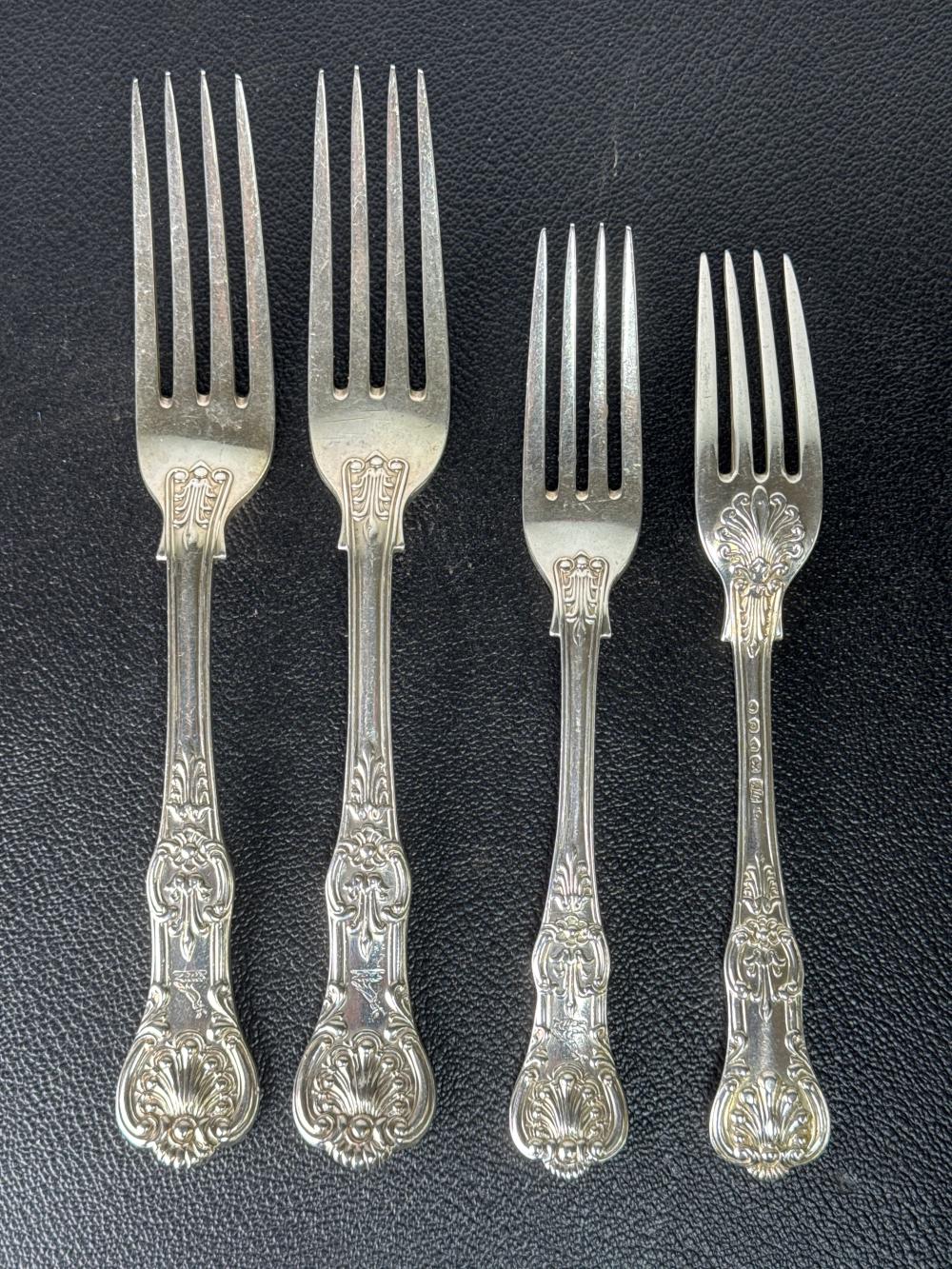 Set of four silver table and dessert forks, Kings pattern, each engraved with armorial crest, London, mid-19th century