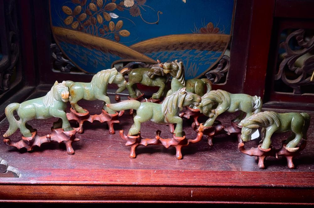 Set of seven Chinese hardstone horses on stands, 20th century