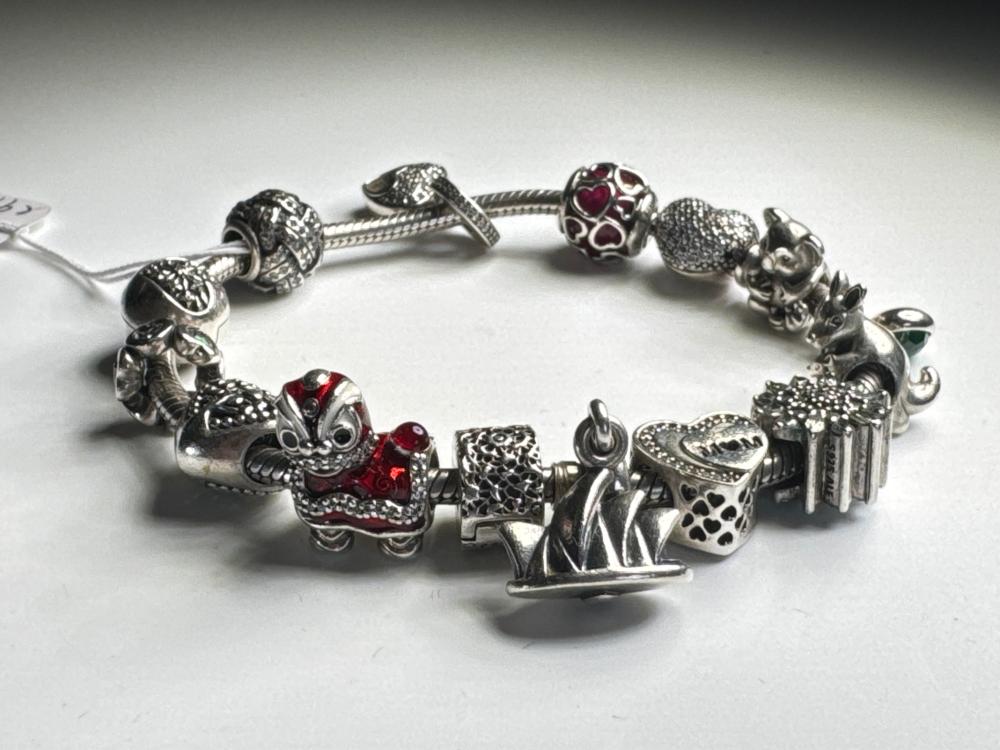Pandora sterling silver charm bracelet with ten charms including Sydney Opera House and Koala, early 21st century
