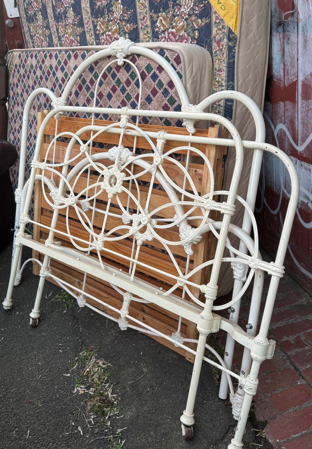Pair of cast iron beds, comprising one queen-size example, circa 1890, and one single example, late 20th century~NO RESERVE!