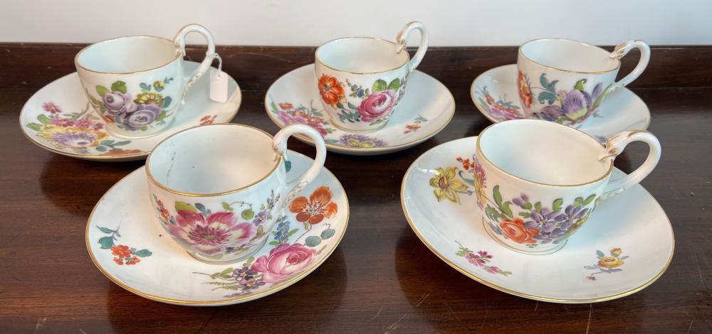 Five Meissen Porcelain Tea Cups and Saucers, swan-head handles, polychrome floral decoration, mid-19th century