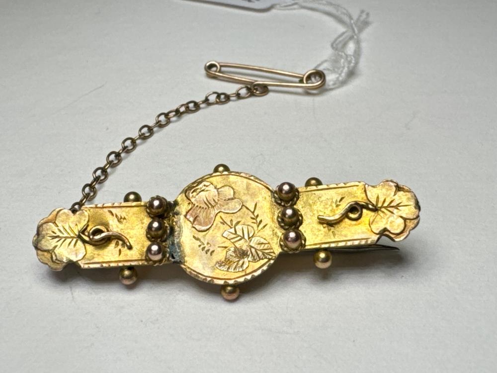 9ct gold bar brooch, engraved floral and foliate decoration with applied bead detail, safety chain, Birmingham 1898