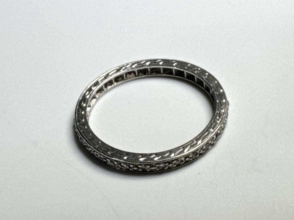 White Gold ring set with rough-cut diamonds in open collet settings, 20th century