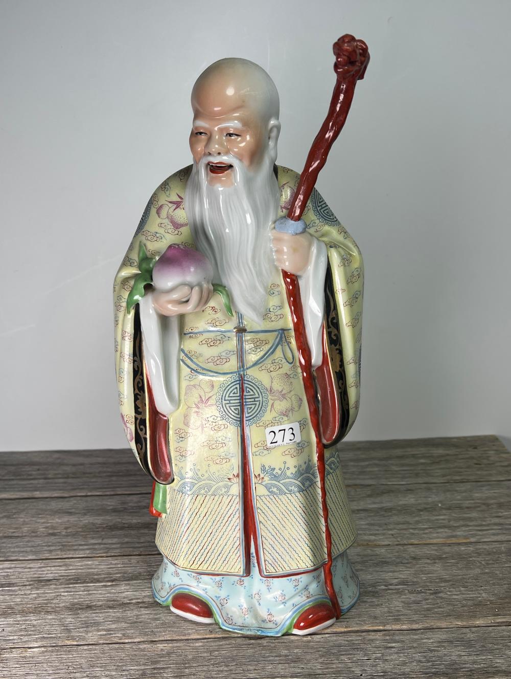 Chinese figure of a dignitary in polychrome robes, 20th century