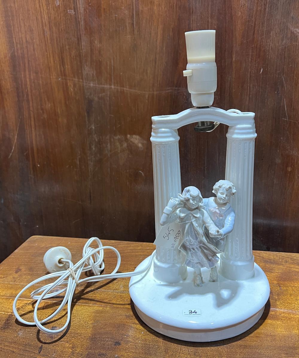 White porcelain figural lamp, ice skaters, impressed mark '20', 20th century